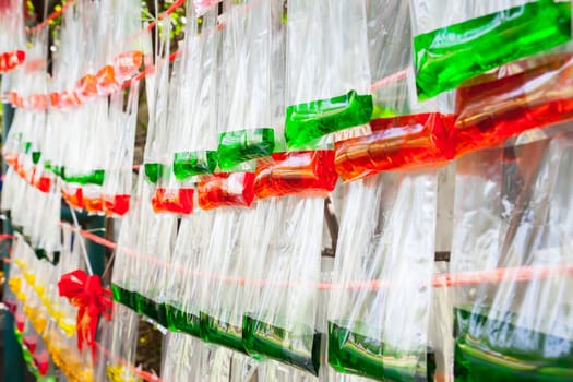 Color water in plastic bag roll to background