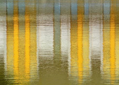 background or texture yellow mirroring on the water