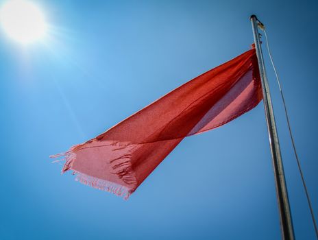 Red Flag At A Beach Warning Of Dangerous Currents