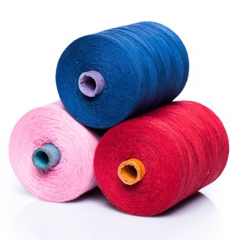 Many colorful threads on white background