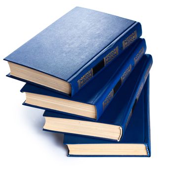 Stack of old books on white background