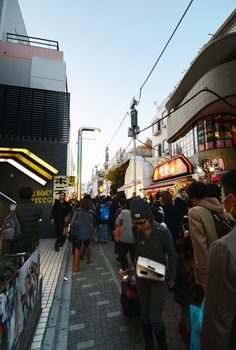 TOKYO, JAPAN - NOV 24 : Crowd at Takeshita street Harajuku on November 24, 2013 in Tokyo, Japan. Takeshita street is a street lined with fashion, cafes and restaurants in Harajuku. 