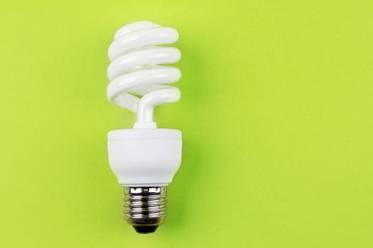 Power saving light bulb on green