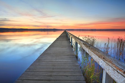 Magnificent sunset and lake reflections at Long Jetty, Central Coast NSW Australia