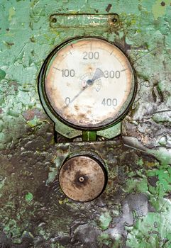 Old gauge panel in the oily green