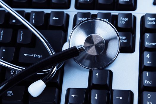 Closeup of stethoscope on keyboard