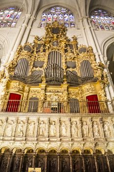 Interior of Toledo Cathedral. Arcs, organ, columns and gothic art. Spain