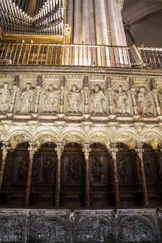 Interior of Toledo Cathedral. Arcs, organ, columns and gothic art. Spain