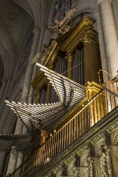 Interior of Toledo Cathedral. Arcs, organ, columns and gothic art. Spain