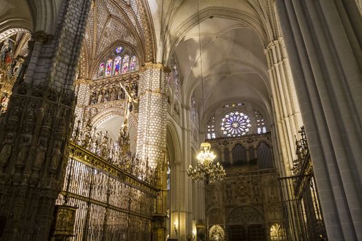 Interior of Toledo Cathedral. Arcs, organ, columns and gothic art. Spain