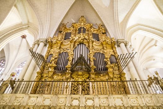 Interior of Toledo Cathedral. Arcs, organ, columns and gothic art. Spain