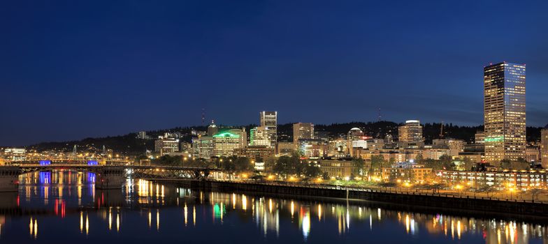 Portland Oregon Downtown City Skyline Along Willamette River Waterfront at Evening Blue Hour Panorama