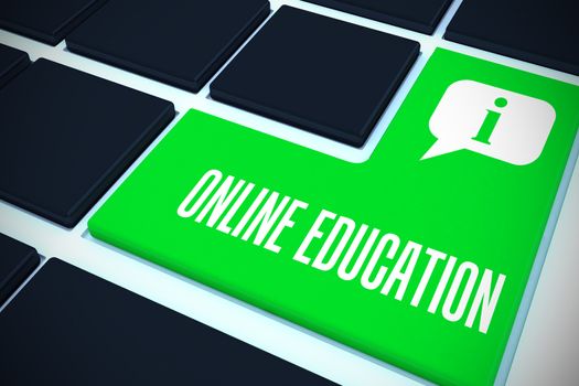 The word online education against green key on black keyboard