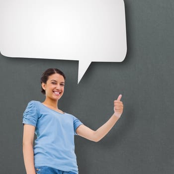 Pretty brunette giving thumbs up against speech bubble