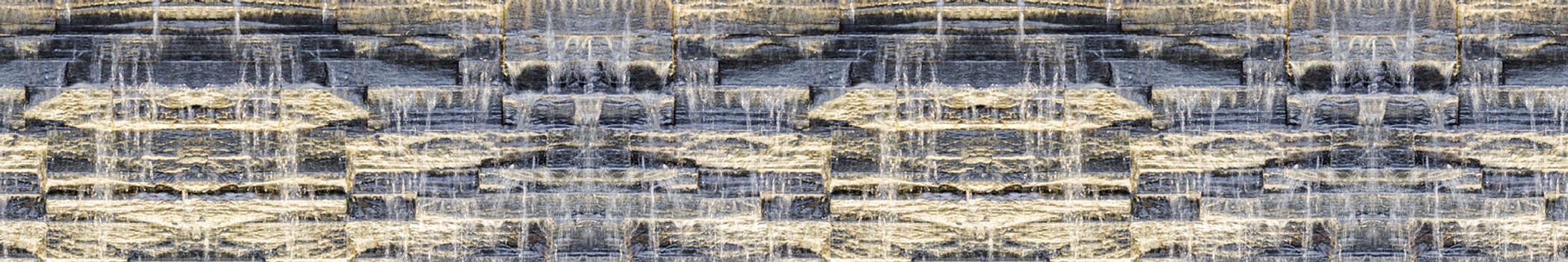 Seamless panoramic dark background of waterfall against stone wall texture with night backlit