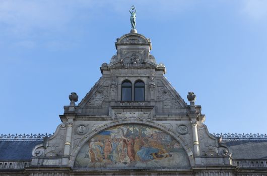 Fresco, painting, and top of historic Ghent Theater facade.