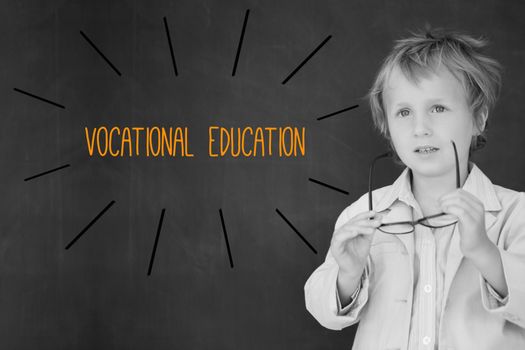 The word vocational education against schoolboy and blackboard
