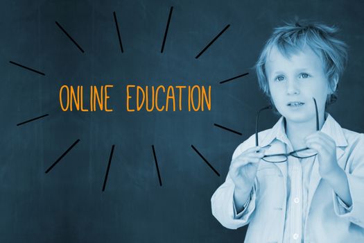The word online education against schoolboy and blackboard