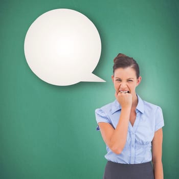 Furious businesswoman looking at the camera against speech bubble