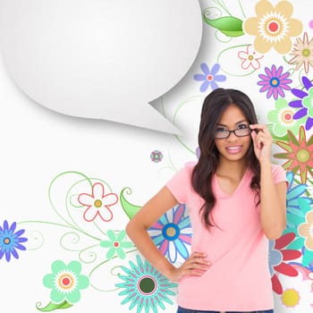 Pretty brunette thinking with speech bubble against digitally generated girly floral design