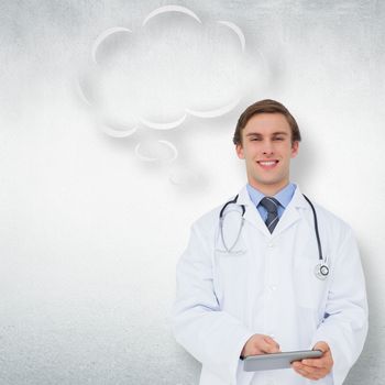 Young doctor using tablet pc with thought bubble against white wall