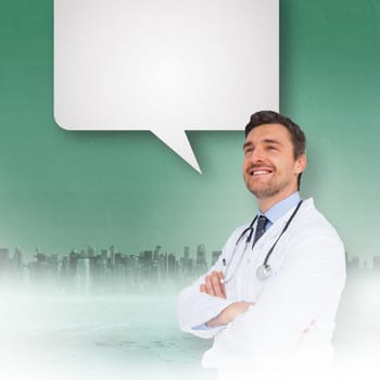 Handsome young doctor with arms crossed with speech bubble against cityscape on the horizon