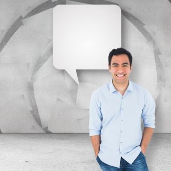 Smiling casual man standing against speech bubble