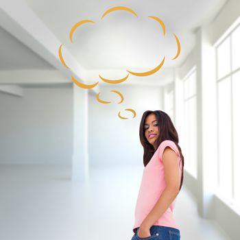 Pretty brunette stepping against white room with windows with thought bubble