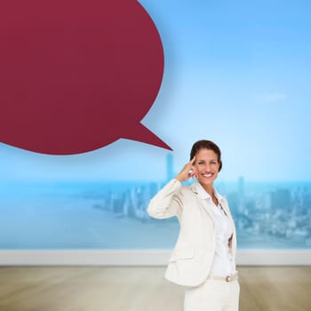 Thinking businesswoman with speech bubble against city projection on wall