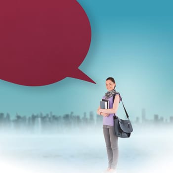 Attractive student with speech bubble while standing against cityscape on the horizon