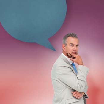Thinking businessman with speech bubble against red vignette