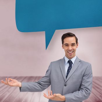 Young businessman presenting something against speech bubble