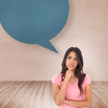 Pretty brunette thinking against speech bubble