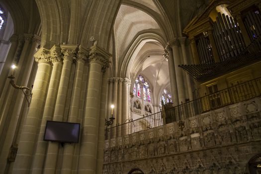 Interior of Toledo Cathedral. Arcs, organ, columns and gothic art. Spain