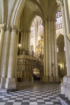 Interior of Toledo Cathedral. Arcs, organ, columns and gothic art. Spain