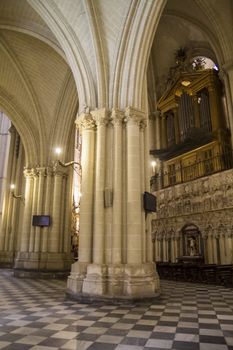 Interior of Toledo Cathedral. Arcs, organ, columns and gothic art. Spain