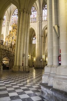 Interior of Toledo Cathedral. Arcs, organ, columns and gothic art. Spain