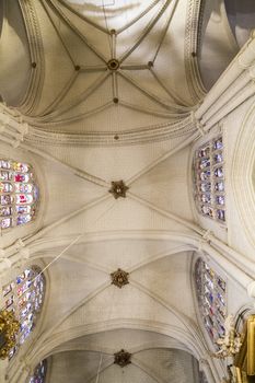 Interior of Toledo Cathedral. Arcs, organ, columns and gothic art. Spain