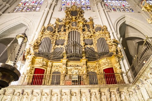 Interior of Toledo Cathedral. Arcs, organ, columns and gothic art. Spain