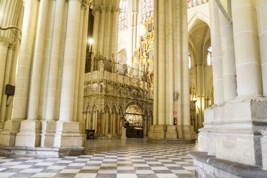 Interior of Toledo Cathedral. Arcs, organ, columns and gothic art. Spain