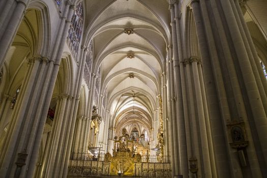 Interior of Toledo Cathedral. Arcs, organ, columns and gothic art. Spain