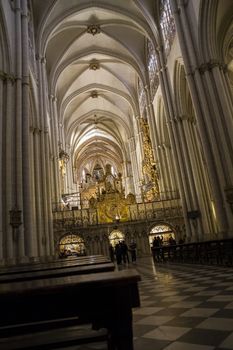 Interior of Toledo Cathedral. Arcs, organ, columns and gothic art. Spain