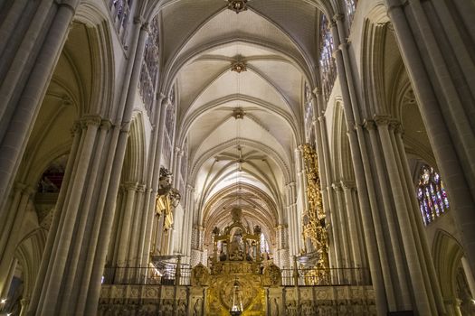 Interior of Toledo Cathedral. Arcs, organ, columns and gothic art. Spain