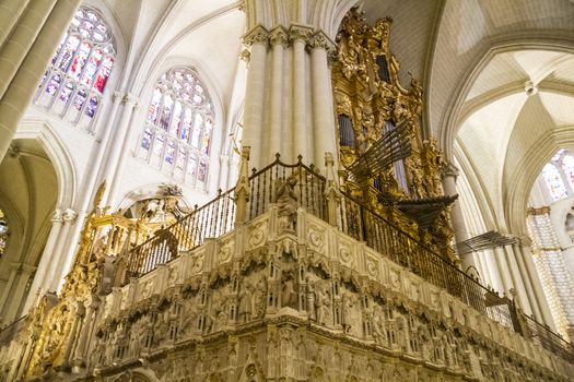 Interior of Toledo Cathedral. Arcs, organ, columns and gothic art. Spain