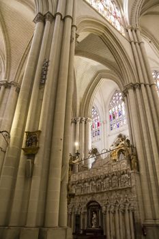 Interior of Toledo Cathedral. Arcs, organ, columns and gothic art. Spain