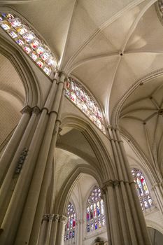 Interior of Toledo Cathedral. Arcs, organ, columns and gothic art. Spain