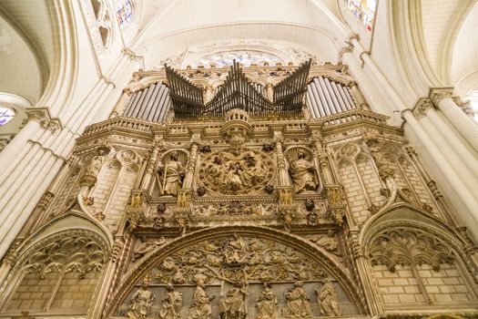 Interior of Toledo Cathedral. Arcs, organ, columns and gothic art. Spain