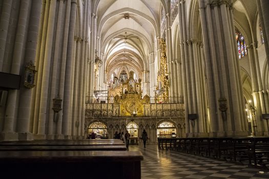 Interior of Toledo Cathedral. Arcs, organ, columns and gothic art. Spain