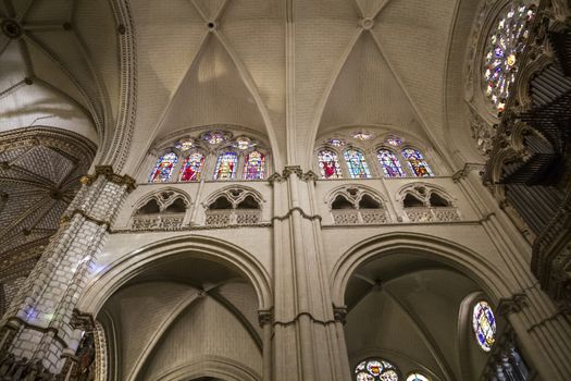 Interior of Toledo Cathedral. Arcs, organ, columns and gothic art. Spain