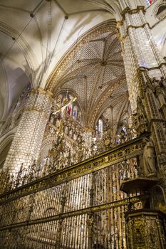 Interior of Toledo Cathedral. Arcs, organ, columns and gothic art. Spain